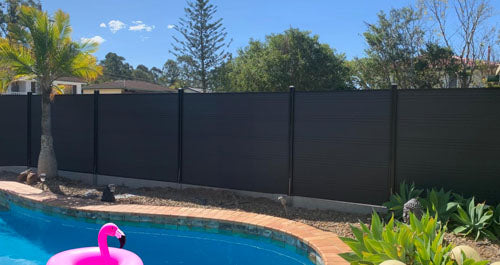 acoustic fencing panels, pool with a pink flamingo, charcoal fence kit