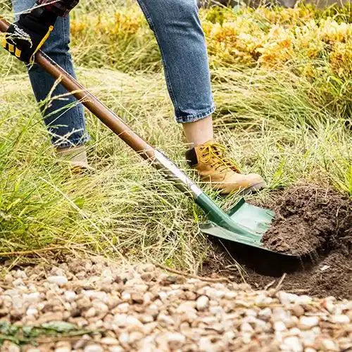 1450mm Square Mouth Post Hole Shovel in use digging a hole - Cyclone | Australian Landscape Supplies