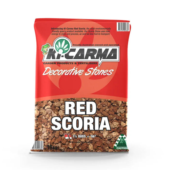 A 16kg bag of K-Carma Red Scoria decorative stones, featuring a red and orange bag with a clear window showing the brown textured stones inside.
