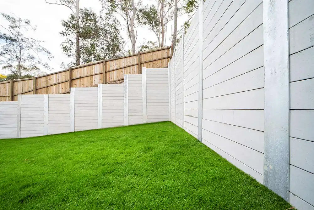 Grey Sleepers with Steel posts and a Timber Fence Available from Australian Landscape Supplies